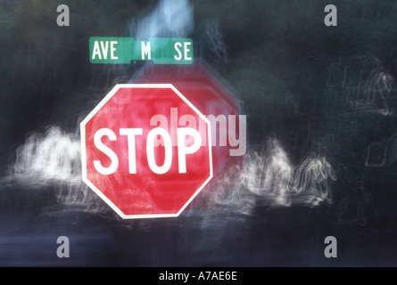 stop sign at night on lonely road abstract Stock Photo