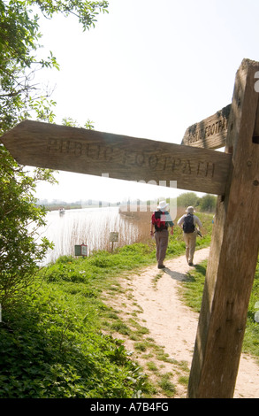 Hikers walking  along the River Arun   near South Stoke towards Arundel, West Sussex, England, UK Stock Photo