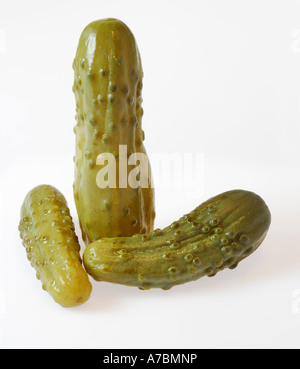 Three pickled cucumbers on white Stock Photo