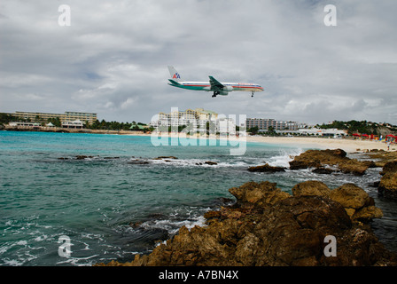 Large jet aircraft landing in St Maarten over Maho Bay beach Netherlands Antilles Caribbean Island Stock Photo