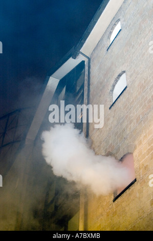 House on fire with flames coming out the windows Stock Photo: 14931666 ...