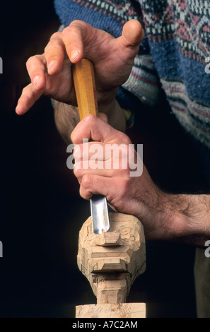 Puppet being carved from wood Stock Photo