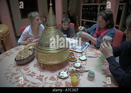 Family having breakfast in riad salon Marrakech, Morocco, Stock Photo