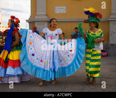 Three attractive local young girl folk dancers in national costumes in Granada city Republic of Nicaragua Central America Stock Photo