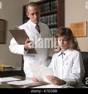 man and woman doctors confer in clinic office Stock Photo