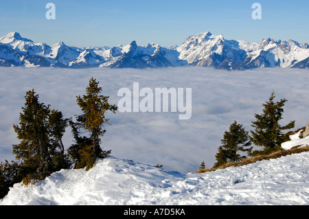 View towards the French Alps with Cornettes de Bise 2432 m across the clouds hanging over Lac Leman Chablais Switzerland France Stock Photo