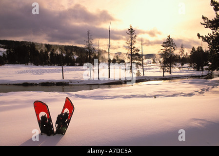 Snowshoes in the snow along the Firehole River in Yellowstone National Park Wyoming Stock Photo