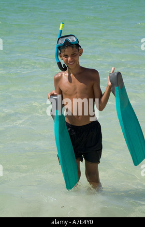 Boy in swim trunks with flippers and snorkel in yard Stock Photo ...