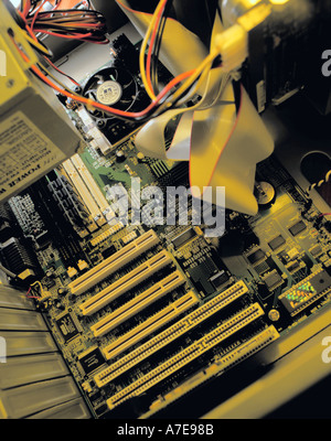 Inside a personal computer, showing mother board with SCSI connections for outlet ports at the base of the picture. Stock Photo