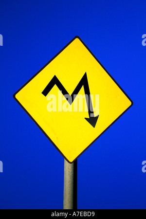 Road Sign with conceptual line graph Metaphor for financial problems ahead Roadsign with graph indicating market volatil Stock Photo