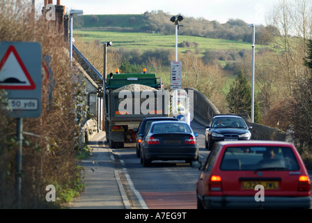 Traffic queuing to cross Swinford toll bridge over the Thames between  Eynsham and Oxford, Oxfordshire, England, UK. Stock Photo