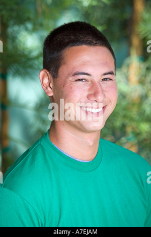 Portrait of young Asian American man outdoors. Stock Photo