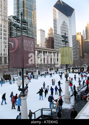 Ice skaters on the rink at Millennium Park in downtown Chicago Illinois U S A Stock Photo