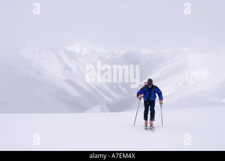skier skinning up the Asulkan Glacier, Rogers Pass area, Selkirk Mountains, Canadian Rockies, British Columbia, Canada Stock Photo