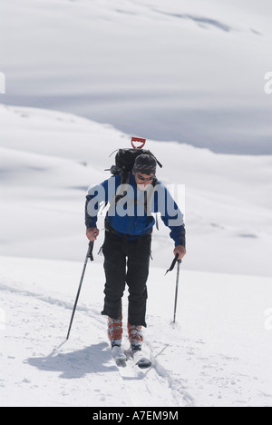 Man skinning on The Illicilliwaet Glacier, Rogers Pass area, Selkirk Mountains, Canadian Rockies, British Columbia, Canada Stock Photo