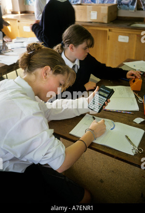 Pupils working with a timer and calculator in a school science class UK Stock Photo