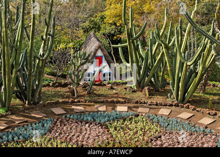 A typical house in the Santana style with a straw covered roof in the botanical garden, Funchal, Madeira, Portugal Stock Photo