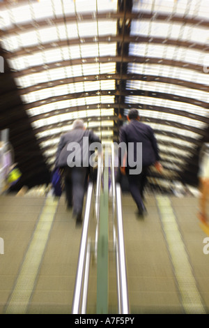 London commuters climbing steps up from the Underground into London Paddington rail station Stock Photo