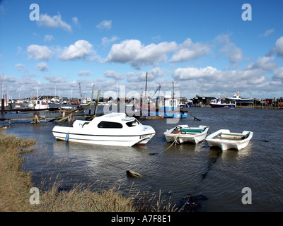 Walberswick near Southwold River Blyth high tide little boats moored at small seaside resort blue sky sunny day in Suffolk East Anglia England UK Stock Photo