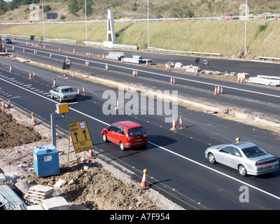 Birchanger Green M11 Motorway roadworks near Bishop Stortford and Stansted Airport at junction 8 speed camera road signs and cones Essex England UK Stock Photo