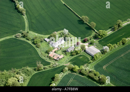 High level oblique aerial view north east of farm buildings fields in Essex north east of Saffron Walden England UK Stock Photo