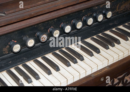 Old antique pump organ keyboard Stock Photo