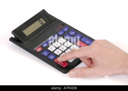 Close up of hand typing on a caluclator Stock Photo