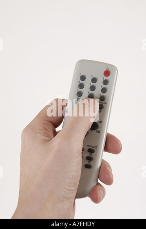 Hand holding a remote control Stock Photo