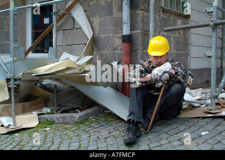 MR worker at building site having a break pause Stock Photo