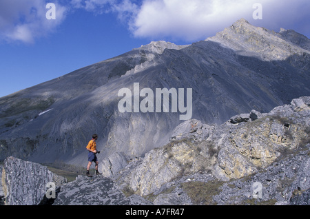 USA, Alaska, Arctic National Wildlife Refuge. Hiker admires scenery along the Kongakut River (MR) Stock Photo