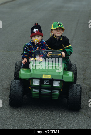 Boys On Toy Jeep in the Uk Stock Photo