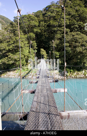 Wire suspension bridge over Haast River at Blue Pools at Gates of Haast South Island New Zealand Stock Photo