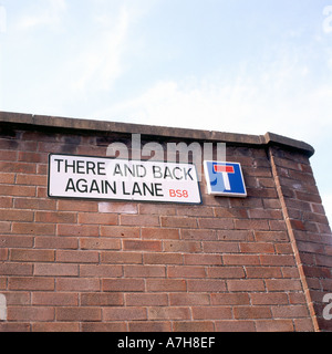 A dead end street sign entitled 'There and Back Again Lane' displayed on a brick wall in Bristol England UK   KATHY DEWITT Stock Photo