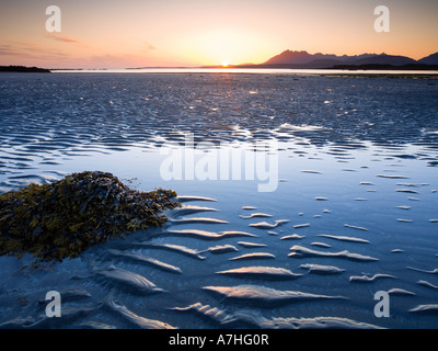 Tarskavaig Bay at sunset looking across Loch Eishort to the Black Cuillin Ridge Sleat Skye Scotland Stock Photo