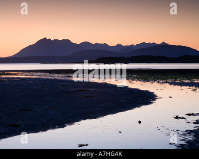 Tarskavaig Bay at sunset looking across Loch Eishort to the Black Cuillin Ridge Sleat Skye Scotland Stock Photo