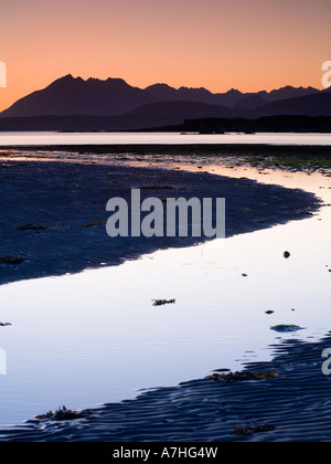 Tarskavaig Bay at sunset looking across Loch Eishort to the Black Cuillin Ridge Sleat Skye Scotland Stock Photo