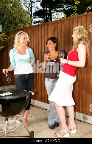 Young Women Having a Barbeque Models Released Stock Photo