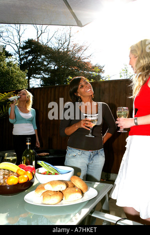 Young Women Having a Barbeque Models Released Stock Photo