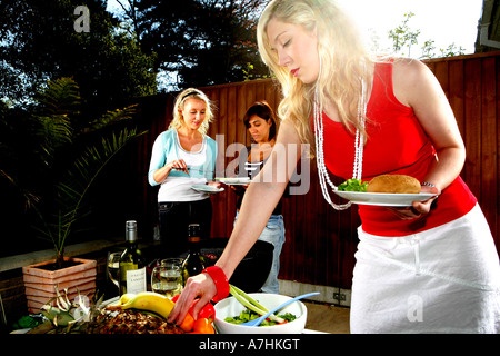 Young Women Having a Barbeque Models Released Stock Photo