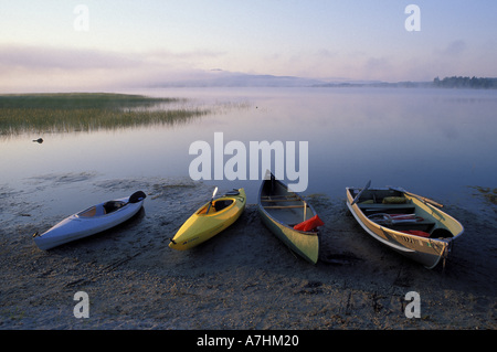 North America, US, ME, Boats on the shore of Webb Lake near Mt. Blue State Park. Northern Forest. Stock Photo