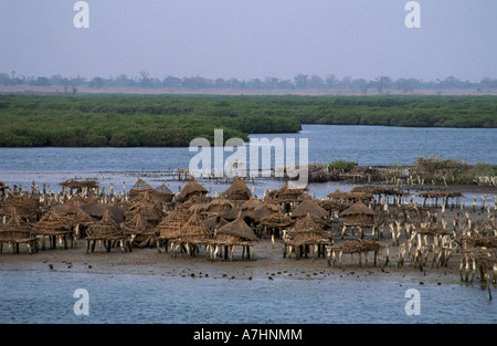 Island composed of shells with granaries on stilts out in the sea to protect from fire Joal Fadiout Senegal Stock Photo