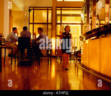 https://l450v.alamy.com/450v/a7hp2j/a-female-waitress-serving-cocktails-inside-the-post-bar-and-the-fullerton-a7hp2j.jpg