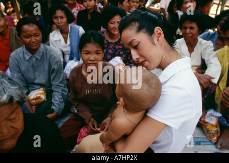Princess Rattana Princess Rattana Norodom of Cambodia handing out alms and interacting ...