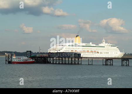 Cruise liner Aurora passing the famous Hythe Railway Pier on Southampton Water southern England United Kingdom UK Stock Photo