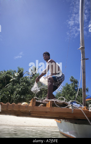 fisherman throwing net in the marshall islands Stock Photo