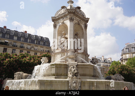 Grand scale fountain in Place Saint Sulpice Paris France Stock Photo