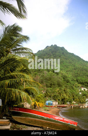 Dominica West Indies Caribbean Fishing Boat on Beach Mountain Background Stock Photo