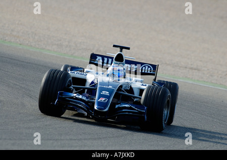 Nico Rosberg races his Williams Formula One racecar around the track at Ricardo Tormo racetrack near Valencia February 2006 Stock Photo