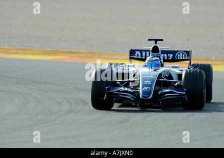 Nico Rosberg races his Williams Formula One racecar around the track at Ricardo Tormo racetrack near Valencia February 2006 Stock Photo