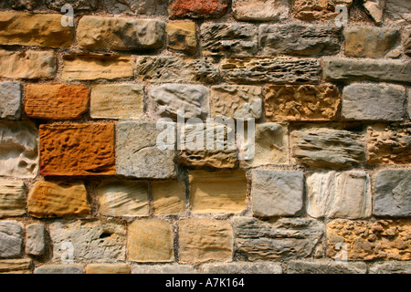 Weathered rustic stone wall - Texture. Stock Photo